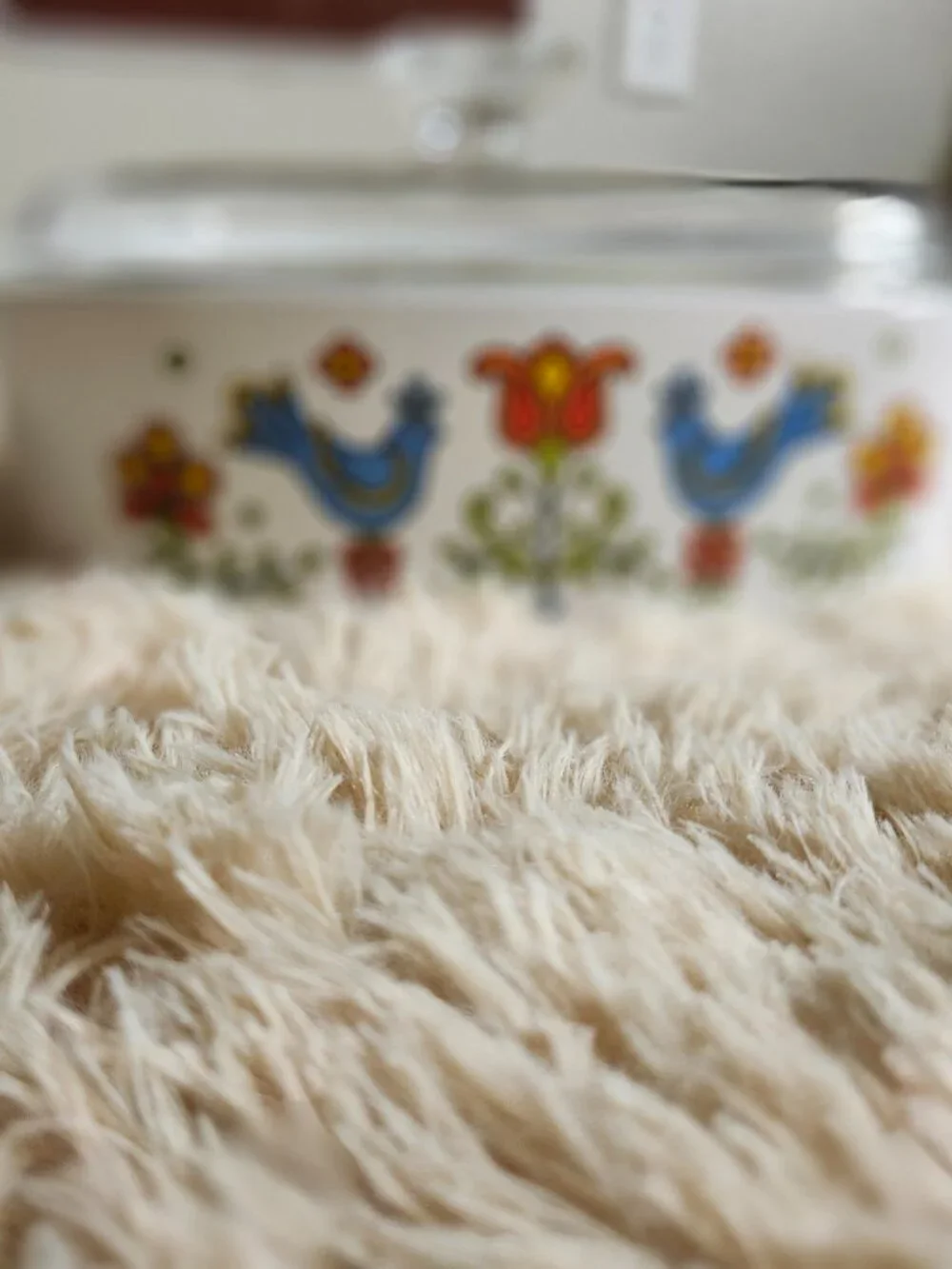 Three CorningWare casserole dishes with lids